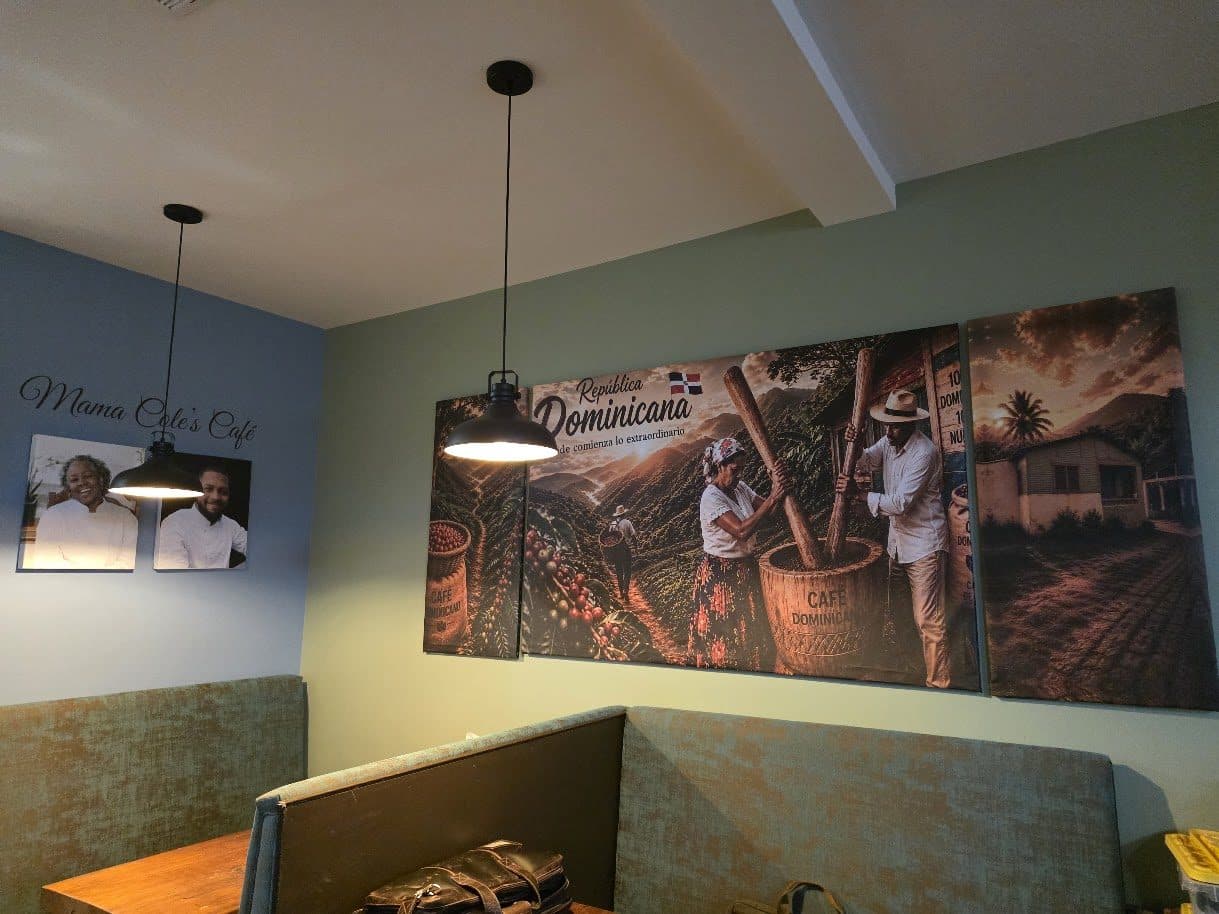 Cozy dining banquette beneath a large wall mural