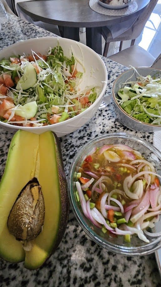 Fresh plated meal with salad and sweet plantain