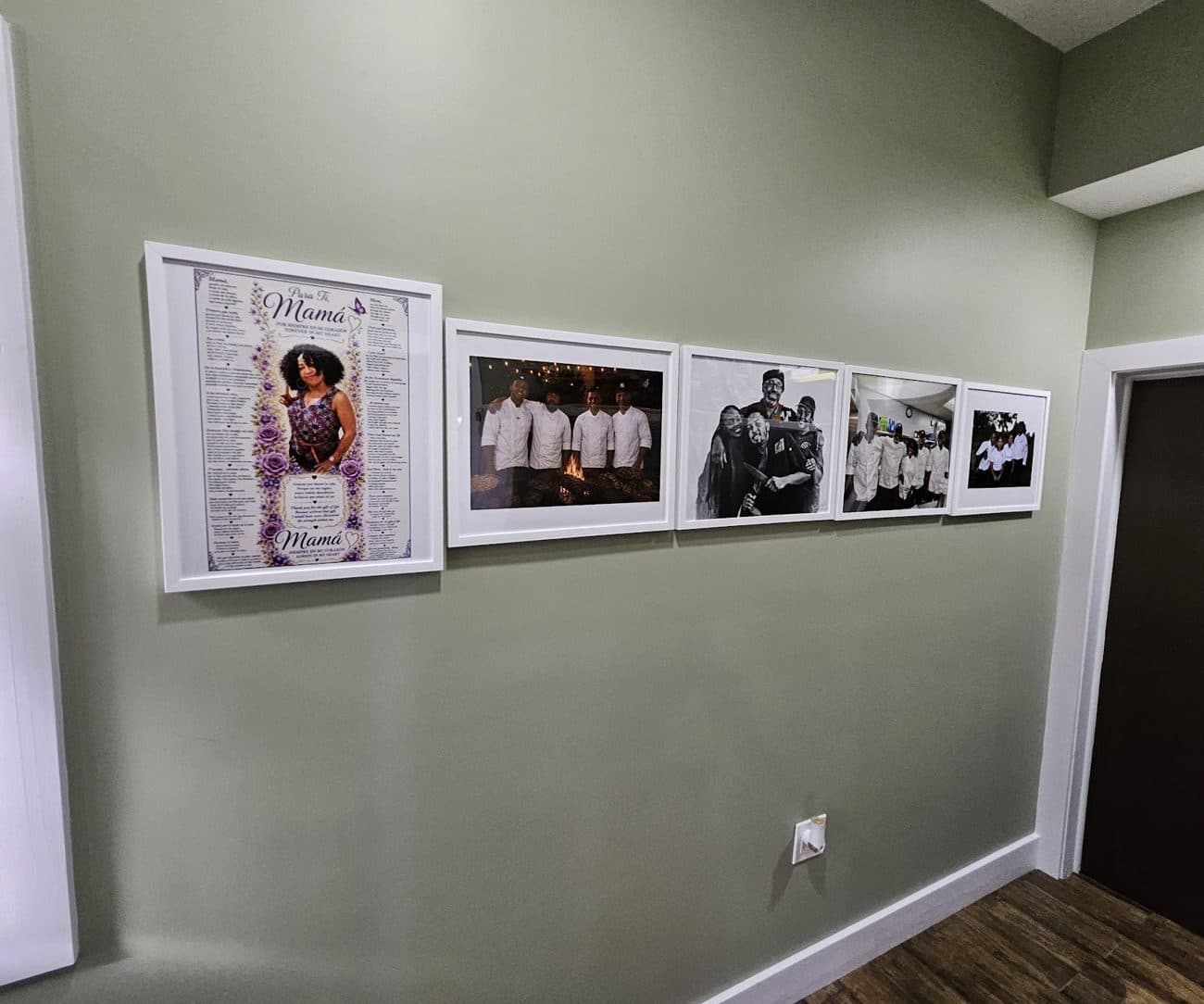Framed photos and press on the dining room wall